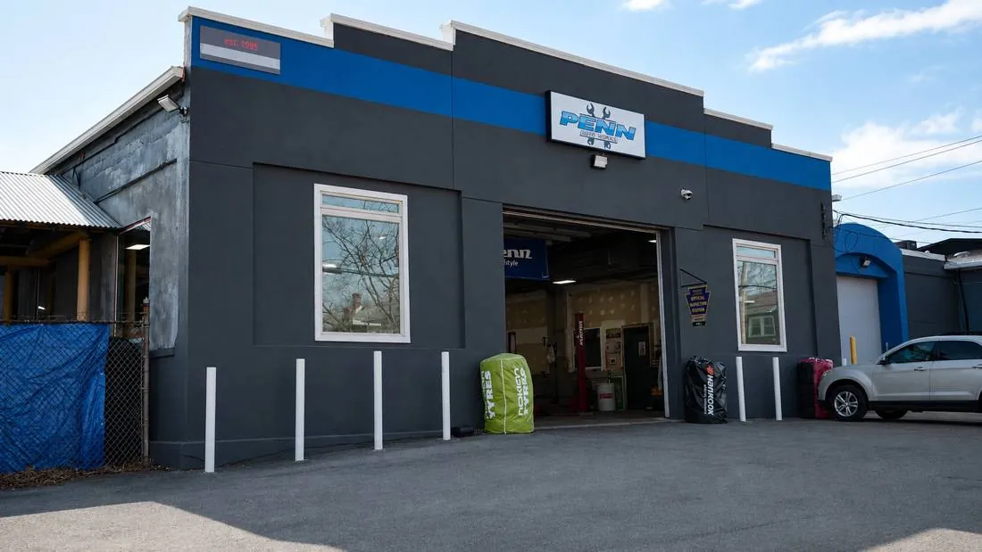 Penn Auto Works shop on South 21st Street with the bay door open